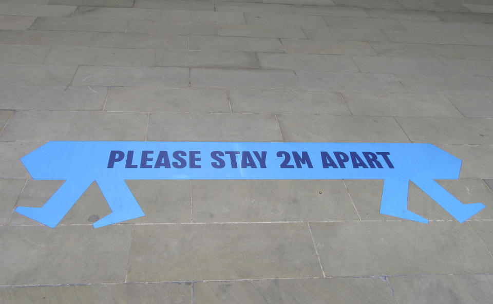  A sign reading 'Please stay 2m Apart' on pavements in London. Social Distancing, Hand Sanitiser stations and NHS signage around London as Lockdown restrictions are loosened by allowing Pubs, Restaurants and all retail to re-open. (Photo by Keith Mayhew / SOPA Images/Sipa USA) 