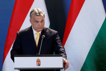 Hungarian Prime Minister Viktor Orban speaks during a press conference in Budapest, Hungary, April 10, 2018. REUTERS/Bernadett Szabo/Files