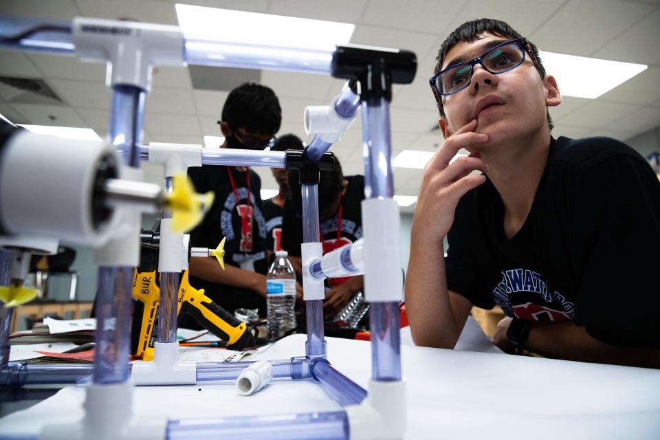 Peyton Porche, 12, works on an underwater robot with the Baker Middle School robotics team on Friday, June 24, 2022. The team's robots will face off against others at a competition later in the year.