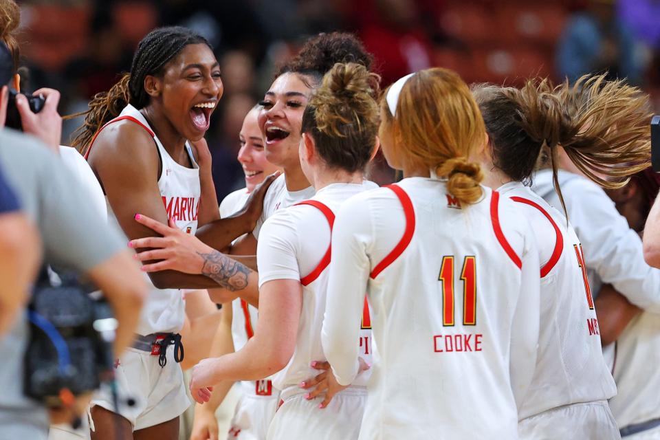 Diamond Miller (left) celebrates with her teammates after Maryland beat Notre Dame to advance to the Elite 8.