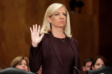 FILE PHOTO: Kirstjen Nielsen is sworn in before testifying to the Senate Homeland Security and Governmental Affairs Committee on her nomination to be secretary of the Department of Homeland Security (DHS) in Washington, U.S. on November 8, 2017. REUTERS/Joshua Roberts/File Photo