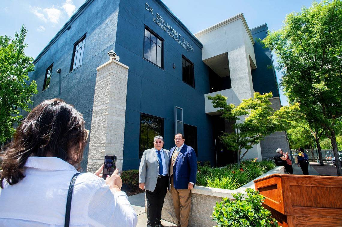 Former Merced College President Dr. Ben Duran poses for photos in front of Merced College’s Dr. Benjamin T. Duran Business Resource Center, following the Merced College State of the College event where he and wife Dr. RoseMary Parga Duran, former Merced City School District Superintendent, were honored with the President’s Medallion Award recognizing them as among the college’s greatest supporters, in Merced Calif, on Thursday, April 25, 2024.