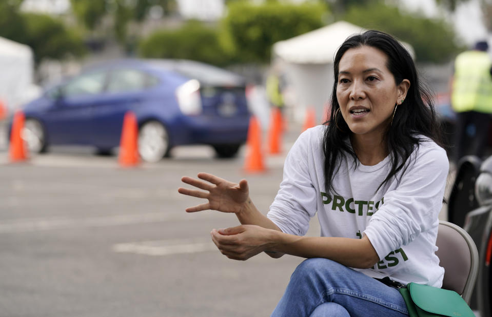 Ann Lee, CEO of Community Organized Relief Effort, is interviewed at a CORE coronavirus testing site at Crenshaw Christian Center, Friday, Aug. 21, 2020, in Los Angeles. The disaster relief organization CORE has gone from providing 6,500 tests in a couple weeks to administering more than 1.3 million within a five-month span. The organization started at four sites in Los Angeles and currently operates in 32 locations in cities including New York, Atlanta, Chicago, Detroit, New Orleans and Washington, D.C. (AP Photo/Chris Pizzello)