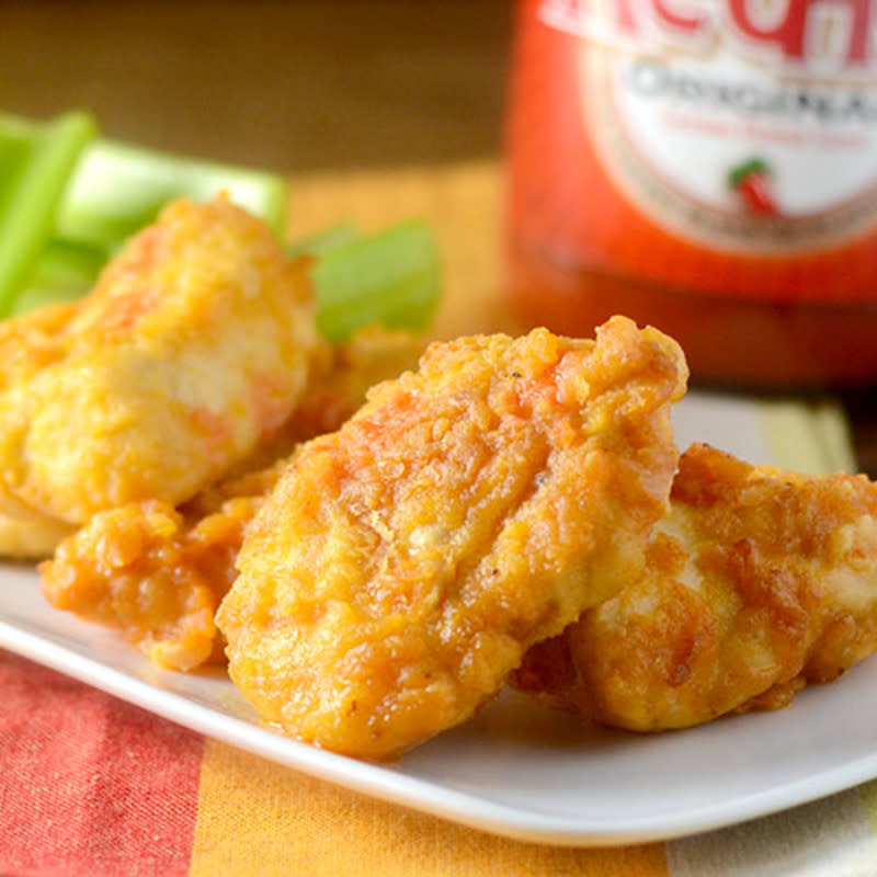 <p>Feed Your Soul Too</p><p>These chicken nuggets are great bite-size pieces of chicken tenders, bathed in Louisiana Hot Sauce and then baked in the oven. Your graduation guests will love these!</p><p><strong>Get the recipe: <a href="http://www.feedyoursoul2.com/2015/04/buffalo-chicken-nuggets.html" rel="nofollow noopener" target="_blank" data-ylk="slk:Buffalo Chicken Nuggets;elm:context_link;itc:0;sec:content-canvas" class="link ">Buffalo Chicken Nuggets</a></strong></p>