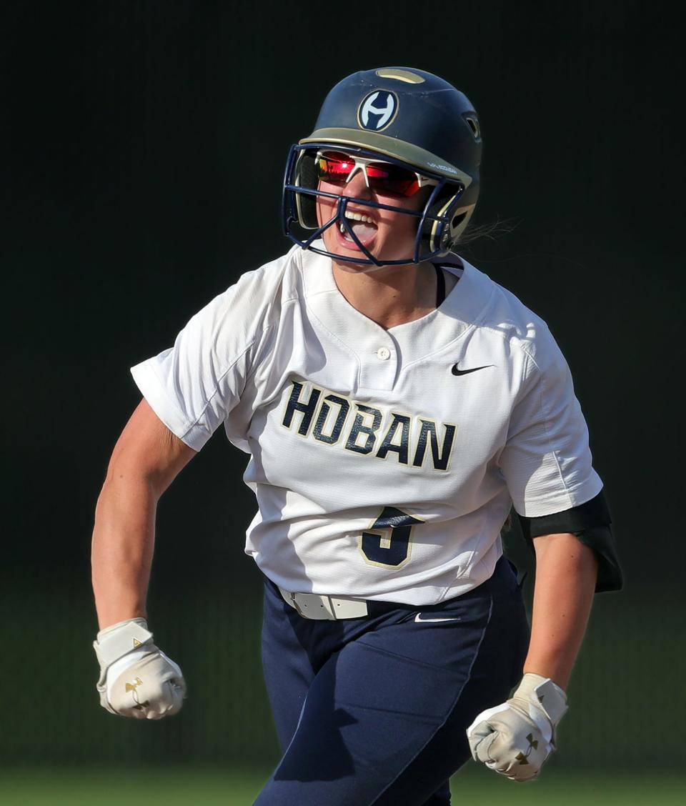 Hoban right fielder Lexi Hart celebrates as she rounds the bases after hitting a two-run homer to left center field against the Field Falcons during the seventh inning of a Division II regional semifinal baseball game in Macedonia on Wednesday.