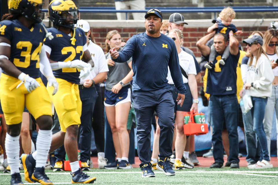 Michigan acting head coach (second half) Mike Hart watches practice before the UNLV game at Michigan Stadium in Ann Arbor on Saturday, Sept. 9, 2023.