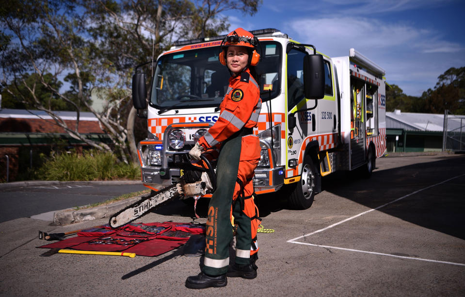 <p>New South Wales state emergency services (SES) volunteer Michelle Whye in uniform in front of an emergency vehicle at the headquarters on February 23, 2018 in Sydney, Australia. (Photo: Peter Parks/AFP/Getty Images) </p>