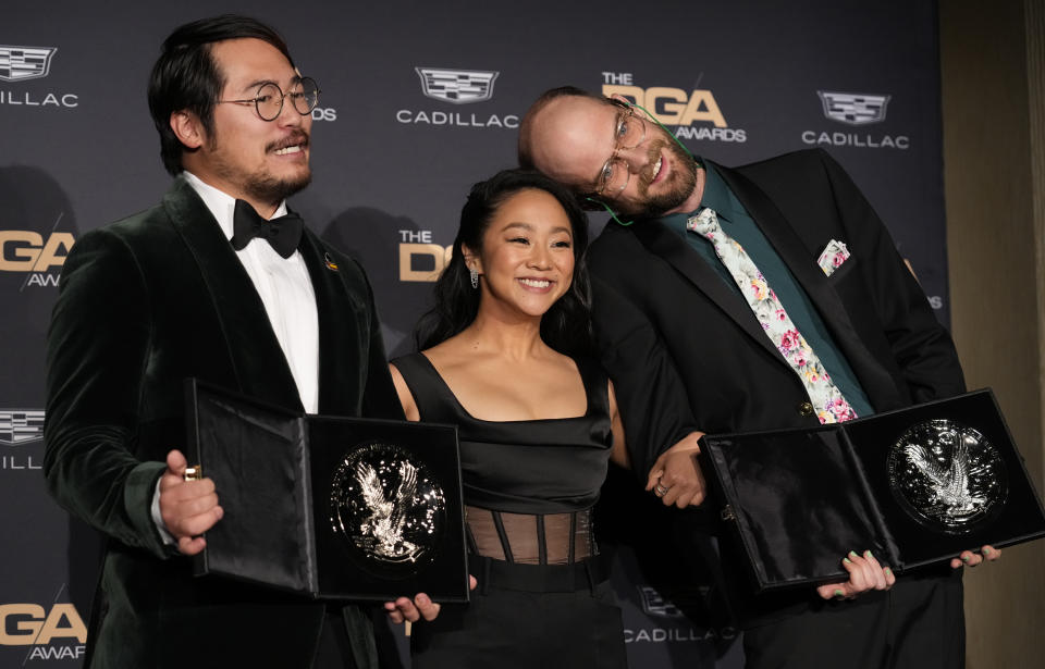 Daniel Kwan, left, and Daniel Scheinert, right, nominees for outstanding directorial achievement in theatrical feature film for "Everything Everywhere All at Once," and presenter Stephanie Hsu pose in the press room at the 75th annual Directors Guild of America Awards on Saturday, Feb. 18, 2023, at the Beverly Hilton hotel in Beverly Hills, Calif. (AP Photo/Chris Pizzello)