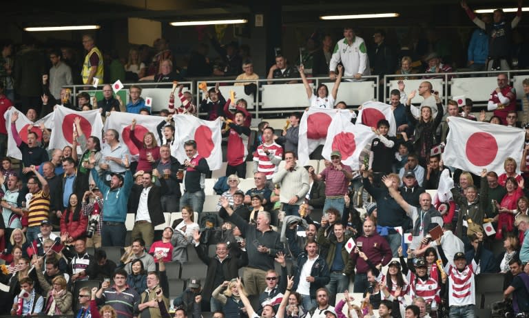 Japanese supporters cheer during a Pool B match of the 2015 Rugby World Cup against Samoa at Stadium mk in Milton Keynes, north of London on October 3, 2015