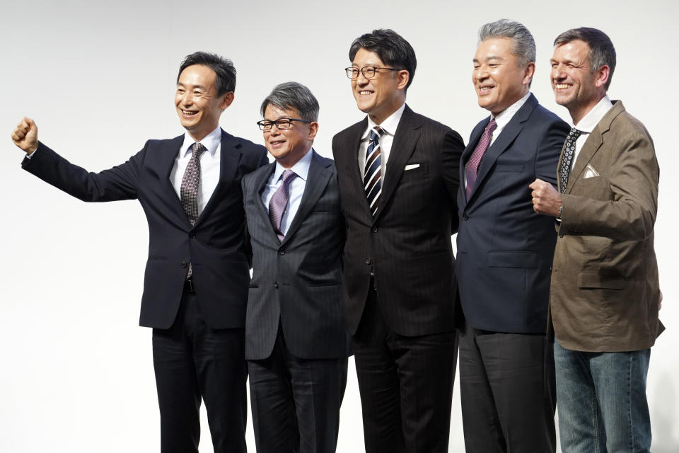 Koji Sato, center, Toyota chief branding officer and CEO-designate poses with his management teams, Kazuaki Shingo, left, chief production officer, Yoichi Miyazaki, second left, executive vice president, CFO, Hiroki Nakajima, second right, executive vice president, CTO, Simon Humphries, right, chief branding officer, during a press conference Monday, Feb. 13, 2023, in Tokyo. Sato, who was appointed the next president at Japan’s top automaker Toyota, introduced a management team Monday that he said will lead an aggressive push on electric vehicles. (AP Photo/Eugene Hoshiko)