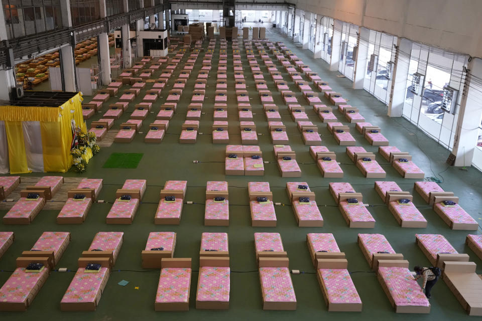 A 1,800-bed field hospital is set up inside a cargo building in Don Mueang International Airport in Bangkok, Thailand, Thursday, July 29, 2021. Health authorities raced on Thursday to set up yet another large field hospital in Thailand's capital as the country recorded a new high in COVID-19 cases and deaths. The hospital, one of many already in use, was being set up at one of Bangkok's two international airports after the capital ran out of hospital beds for thousands of infected residents. (AP Photo/Sakchai Lalit)