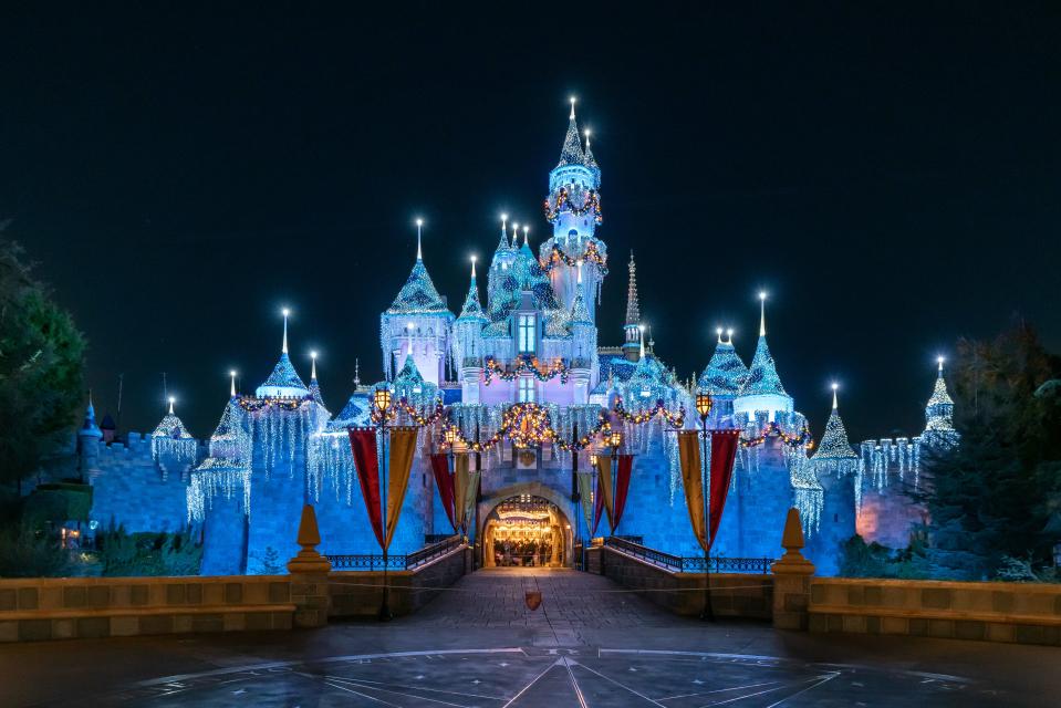 General views of Sleeping Beauty Castle at Disneyland, dressed up for the holiday season.