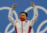 Xie Siyi of China reacts after winning gold medal in men's diving 3m springboard final at the Tokyo Aquatics Centre at the 2020 Summer Olympics, Tuesday, Aug. 3, 2021, in Tokyo, Japan. (AP Photo/Dmitri Lovetsky)