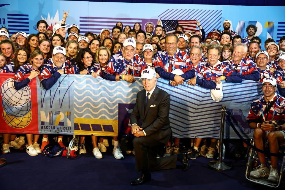 Joe Biden poses with US athletes at the opening ceremony of the 2022 Maccabiah Games (REUTERS)