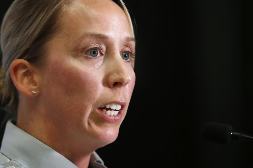 Royal Canadian Mounted Police Cpl. Julie Courchaine speaks to media about the ongoing RCMP search in Gillam, Manitoba, for the British Columbia murder suspects Bryer Schmegelsky and Kam McLeod, in Winnipeg, Manitoba, Friday, July 26, 2019. Gillam is more than 2,000 miles from northern British Columbia, where the three people were found slain. (John Woods/The Canadian Press via AP)