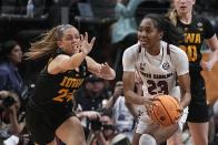 South Carolina's Bree Hall tries to get past Iowa's Gabbie Marshall during the first half of an NCAA Women's Final Four semifinals basketball game Friday, March 31, 2023, in Dallas. (AP Photo/Darron Cummings)