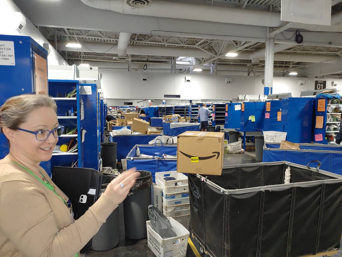 Kim Frum, strategic communications specialist for the U.S. Postal Service, explains how a high-tech modernization of the Pasco Post Office transformed it into a sorting and delivery station. Wendy Culverwell/Tri-City Herald