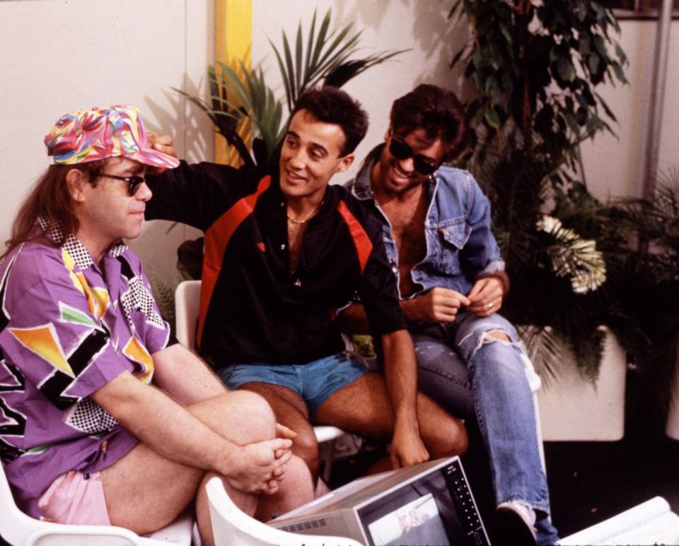 <p>Elton John joins his friends and fellow musicians, Andrew Ridgeley and George Michael, backstage at Wembley Stadium in 1986.</p>