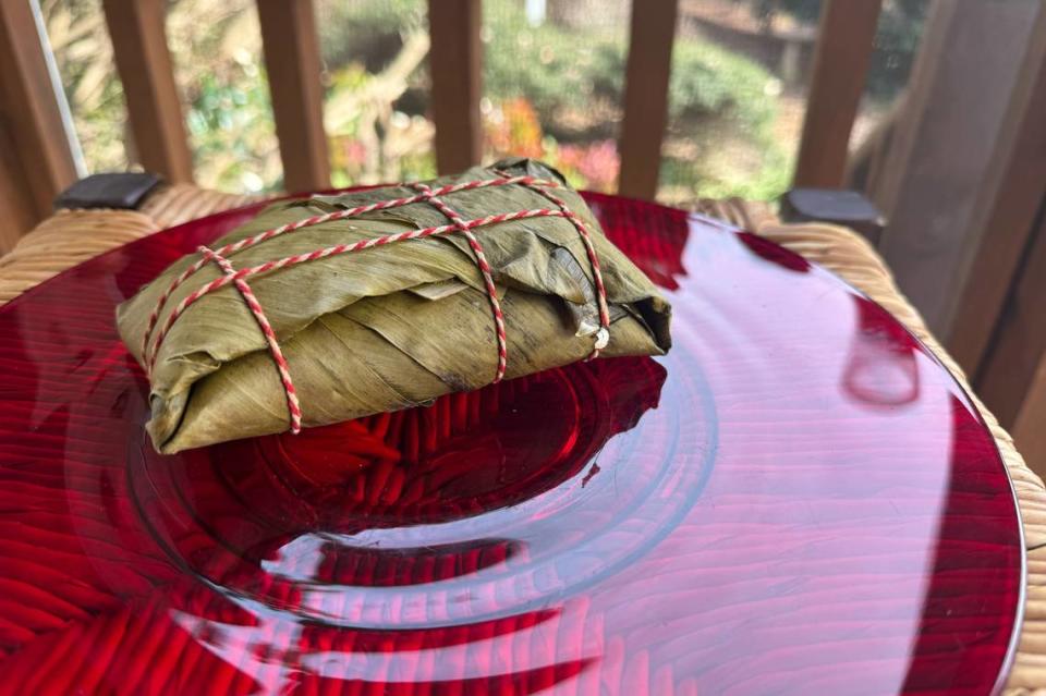 Hallaca from Charlotte’s Los Chamos restaurant are wrapped in plantain leaf before boiling.