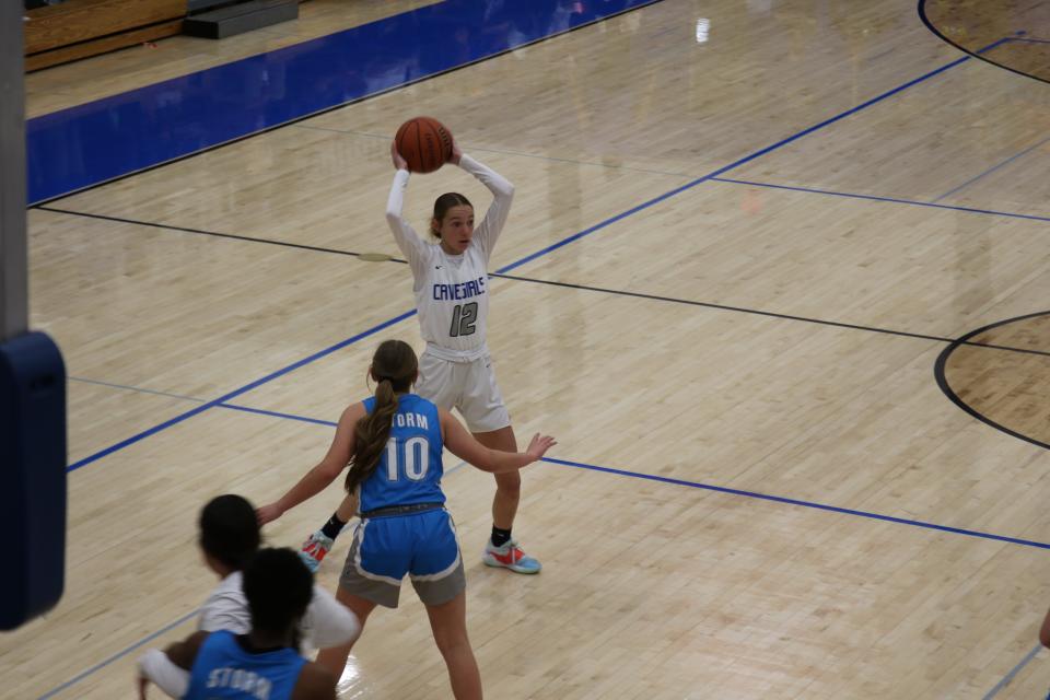 Carlsbad's Abbey Dugan looks to pass to teammate during the opening round of the state basketball tournament.