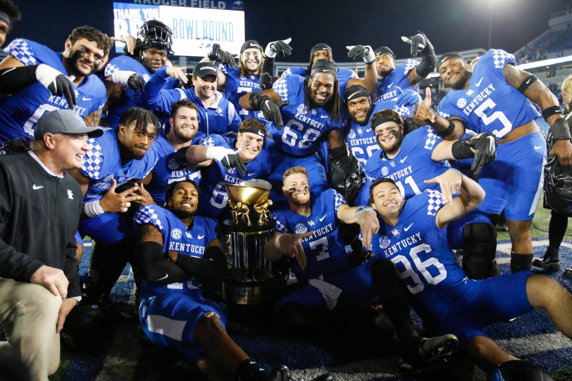 The Kentucky Wildcats celebrates defeating the Louisville Cardinals 26-13 to win during the Governor’s Cup at Kroger Field in Lexington, Ky., Saturday, November 26, 2022.