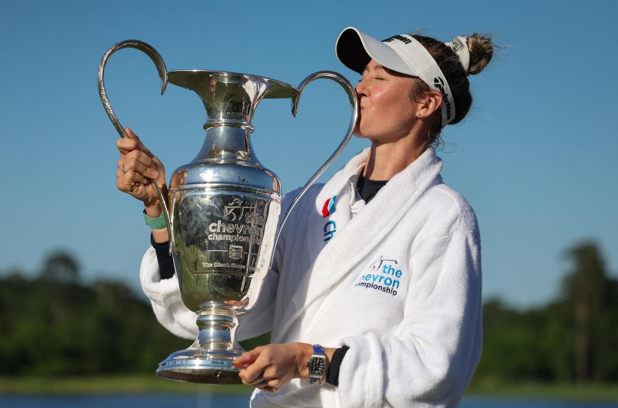 Apr 21, 2024; The Woodlands, Texas, USA; Nelly Korda (USA) kisses the trophy after winning The Chevron Championship golf tournament. Mandatory Credit: Thomas Shea-USA TODAY Sports