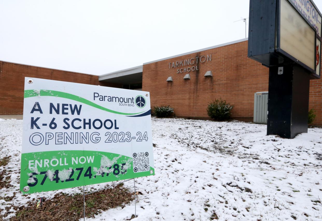 A sign seeking students to enroll in the new Paramount charter elementary school sits Tuesday, Jan. 24, 2023, at the former Tarkington Elementary School building on Hepler Street in South Bend. The charter school is expected to open for students on July 31.