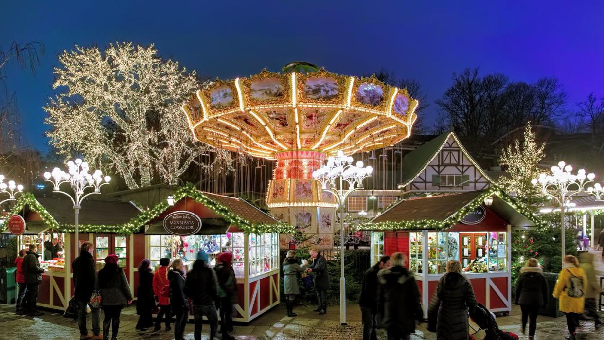 christmas market with carousel in the liseberg amusement park in gothenburg, sweden