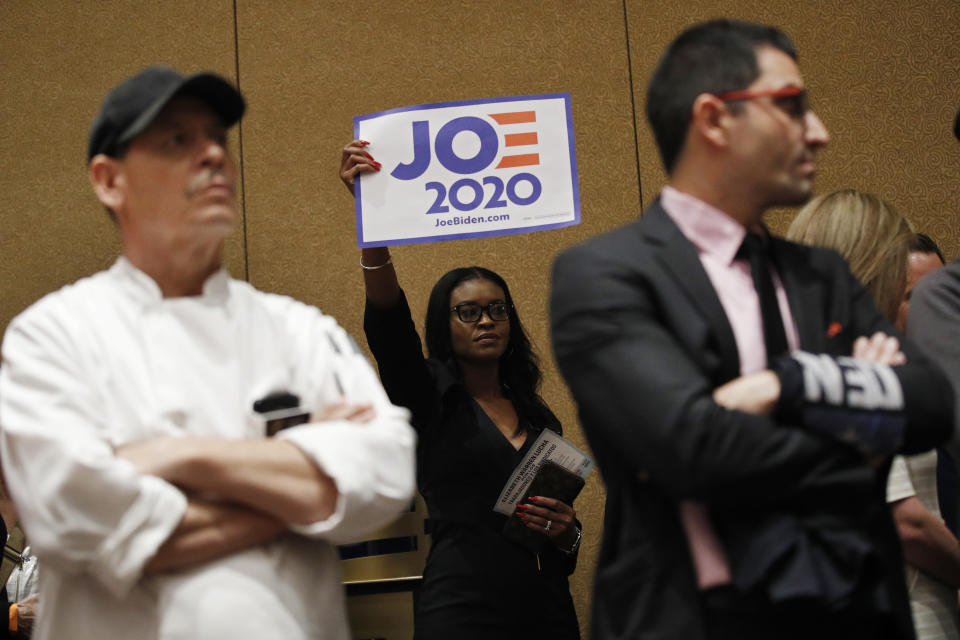 Casino workers and other supporters of Democratic presidential candidate former Vice President Joe Biden caucus at the Bellagio hotel-casino, Saturday, Feb. 22, 2020, in Las Vegas. (AP Photo/John Locher)