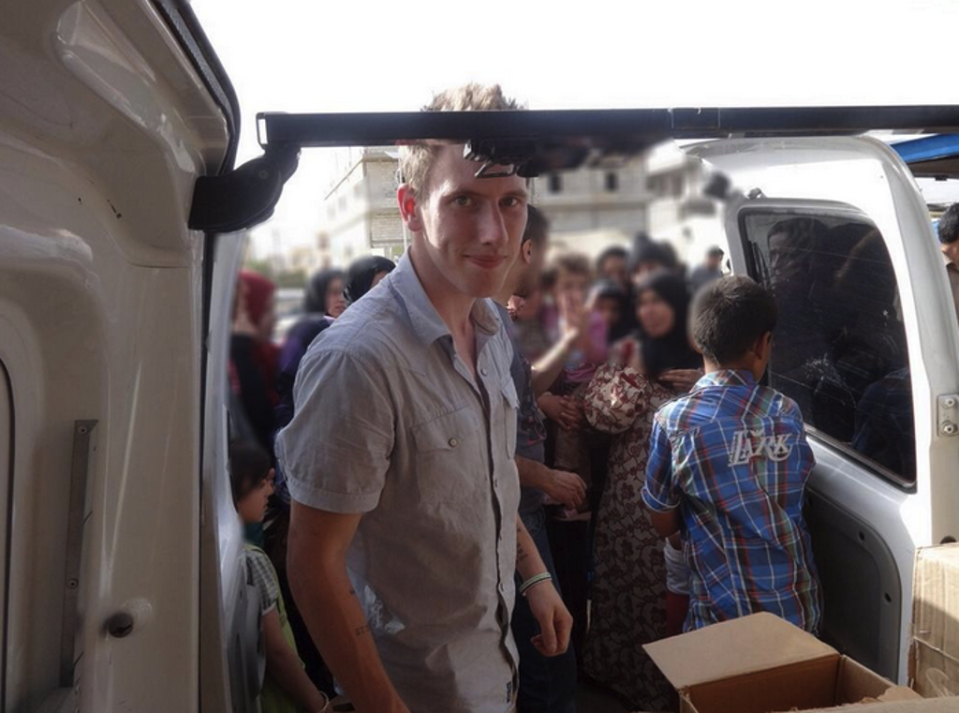 Peter Kassig delivering aid in Bekaa Valley, in Lebanon; May, 2013