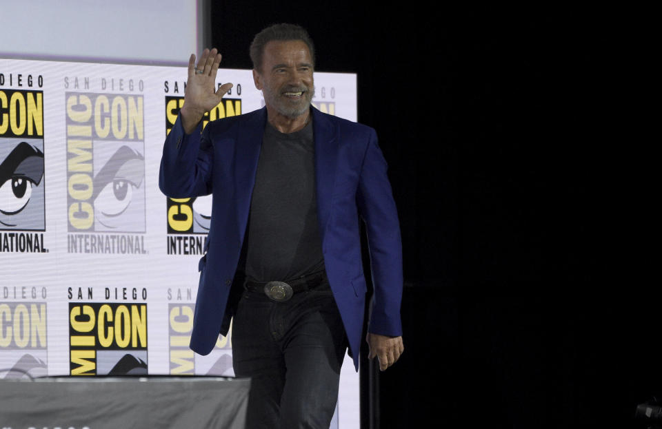 Arnold Schwarzenegger walks on stage at the "Terminator: Dark Fate" panel on day one of Comic-Con International on Thursday, July 18, 2019, in San Diego. (Photo by Chris Pizzello/Invision/AP)