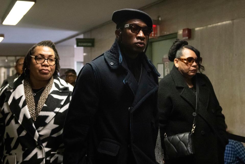 Jonathan Majors, center, arrives at court for a trial on his domestic violence case on Dec. 4, 2023, in New York.