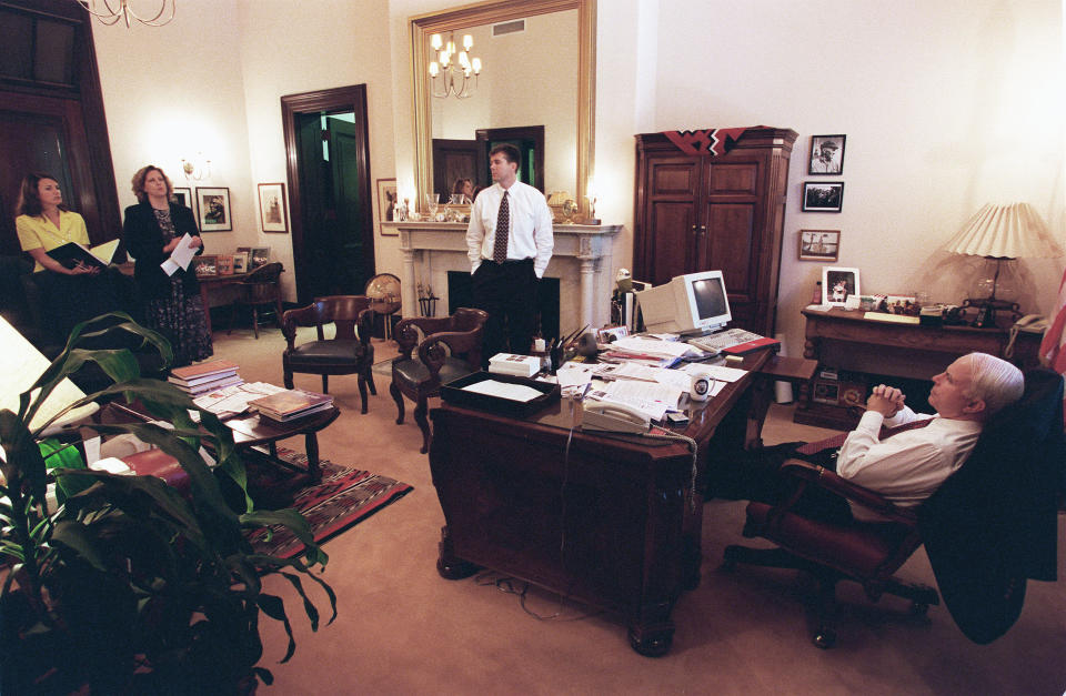 <p>Press secretary Nancy Ives, legislative director Ann Sauer and John Raidt, the Commerce Committee staff director for the majority, brief Sen. John McCain after he arrived in the early afternoon from a trip to Hawaii to celebrate his 18th wedding anniversary with his wife, Cindy, and to address the Hawaii GOP on May 18, 1998. (Photo: Scott J. Ferrell/Congressional Quarterly/Getty Images) </p>