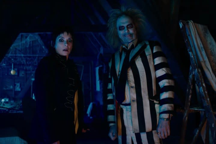 A woman and Betelgeuse stand next to each other with confused looks on their faces.