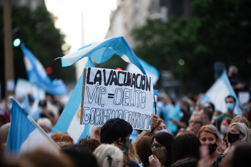 BUENOS AIRES, ARGENTINA - 2021/02/27: A protester holding a placard that reads, 