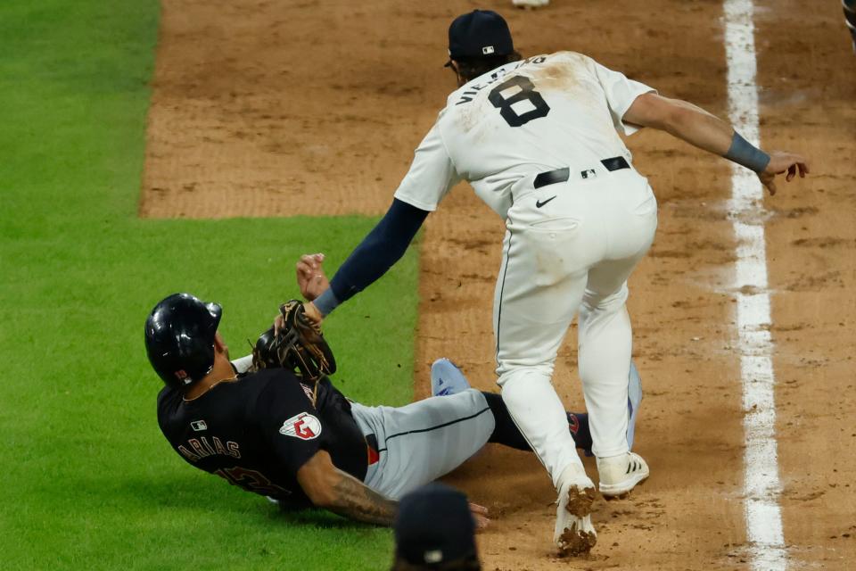 Cleveland Guardians' Gabriel Arias (13) is tagged out by Detroit Tigers third baseman Matt Vierling (8) in the ninth inning Wednesday in Detroit.