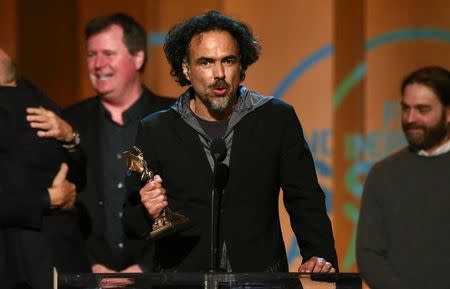 Writer and director Alejandro Gonzalez Inarritu accepts the Best Feature award for the film "Birdman" at the 2015 Film Independent Spirit Awards in Santa Monica, California February 21, 2015. REUTERS/Adrees Latif