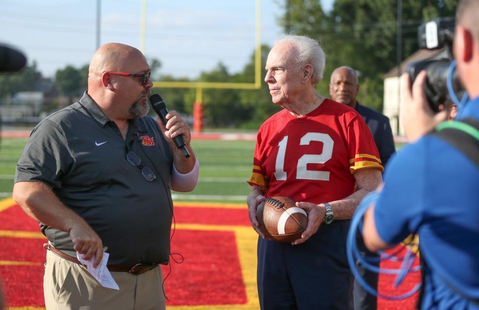 Roger Staubach talks to Purcell Marian principal Andy Farfsing. Purcell Marian High School debuted its new on-campus stadium, Roger Staubach Stadium, Aug. 18, 2023