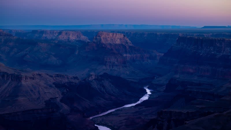 The Colorado River flows through the Grand Canyon at sunrise as seen from the south rim in Grand Canyon National Park in Arizona on Tuesday, Oct. 11, 2022.