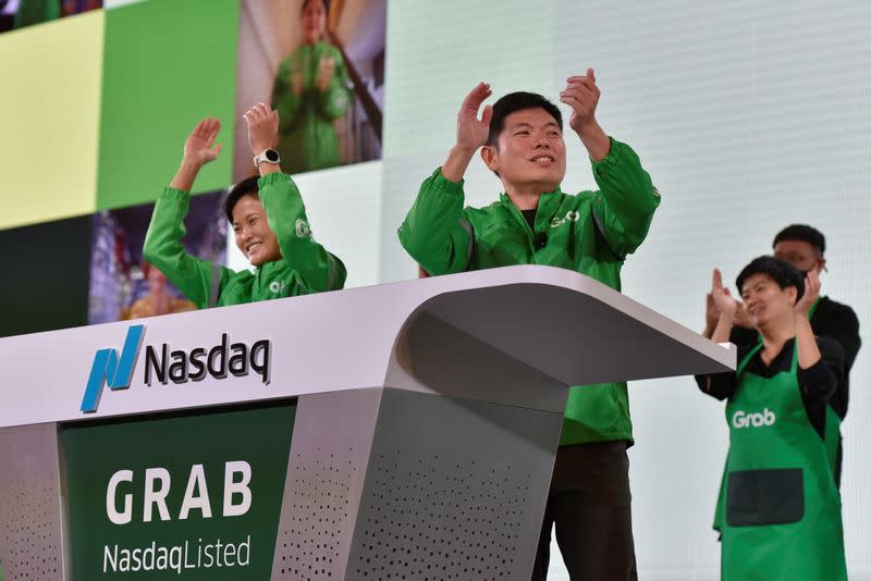 Grab's CEO Anthony Tan and co-founder Tan Hooi Ling at the Grab Bell Ringing Ceremony at a hotel in Singapore