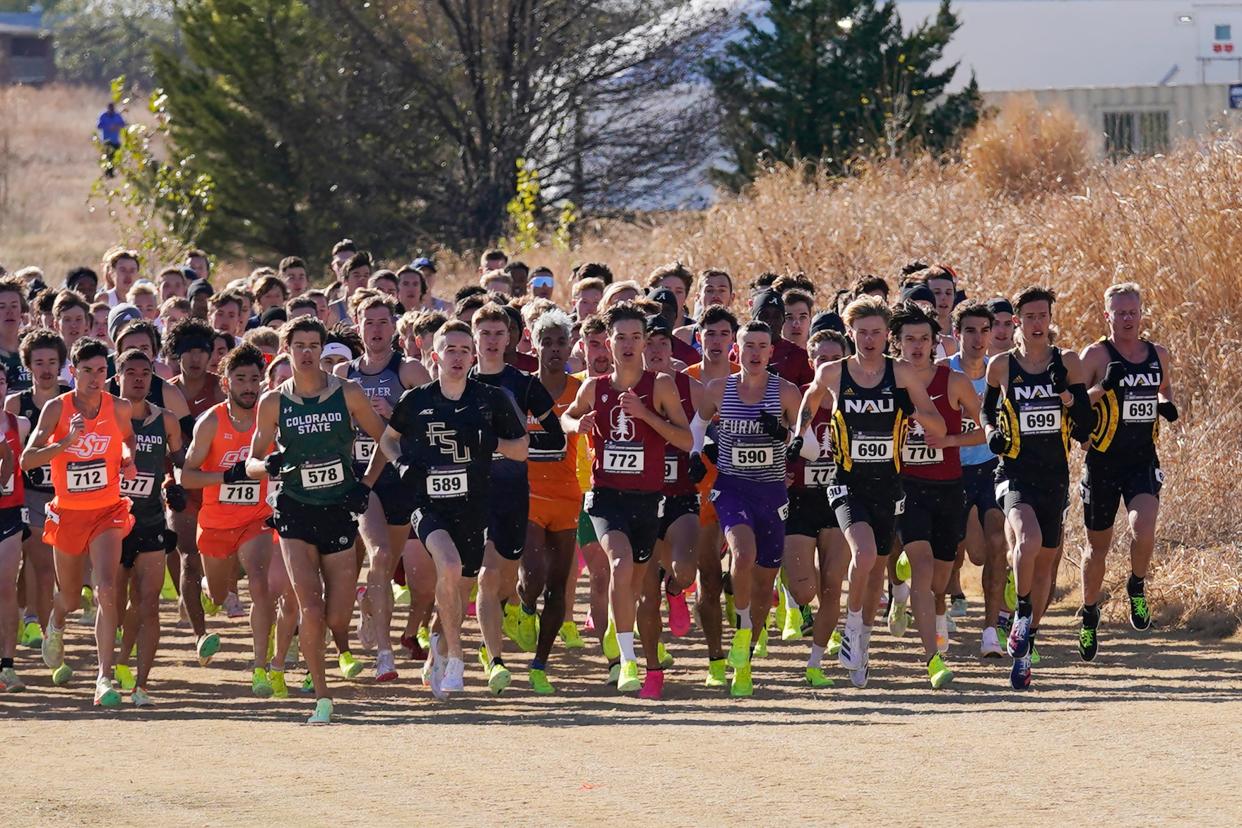 Runners near the start of the men's NCAA Cross Country Championships, Saturday, Nov. 19, 2022, in Stillwater, Okla. (AP Photo/Sue Ogrocki)