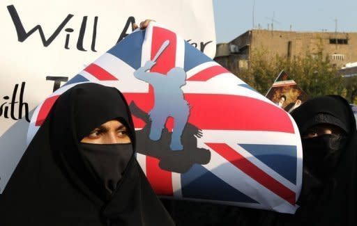 Iranian protesters demonstrate outside the British embassy in Tehran on November 29. Iran's regime has started to distance itself from militant protesters who stormed Britain's embassy, after seemingly being caught off balance by the retaliatory closure of its mission in London