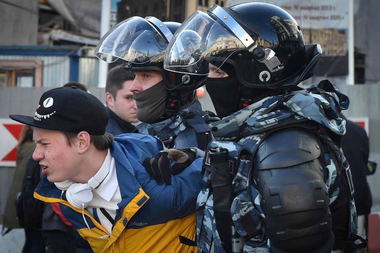 Police officers detain a man after a rally urging fair elections in Moscow in August: AFP