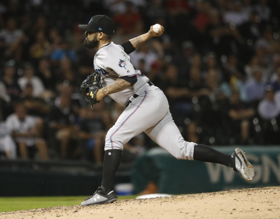 Miami Marlins relief pitcher Sergio Romo delivers during the ninth inning of a baseball game against the Chicago White Sox Wednesday, July 24, 2019, in Chicago. The Marlins won 2-0. (AP Photo/Charles Rex Arbogast)
