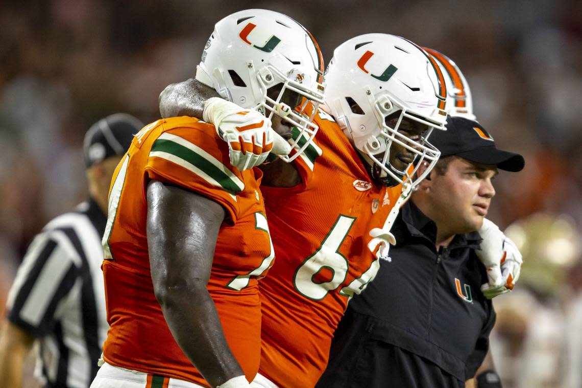 Miami Hurricanes offensive lineman Jalen Rivers (64) is helped off the field after an injury during an ACC football game against Florida State University at Hard Rock Stadium in Miami Gardens on Saturday, November 5, 2022.