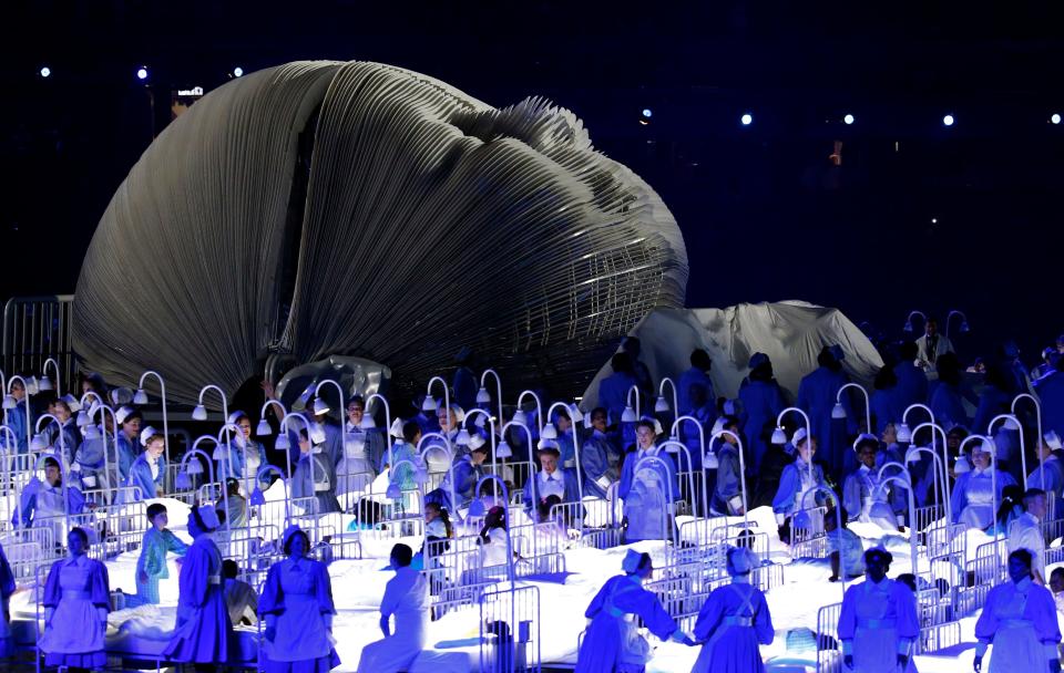 Actors perform in a sequence meant to represent Britain's National Health Service during the opening ceremony of the Summer Olympic Games in London on July 27, 2012.