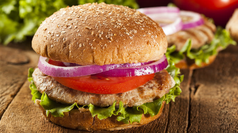 Turkey burger with onion and tomatoes