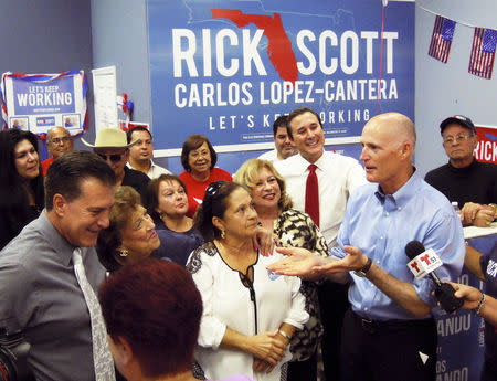 Florida Governor Rick Scott visits a campaign office in the Miami, Florida suburb of Hialeah, heart of the Cuban American community September 22, 2014. REUTERS/David Adams