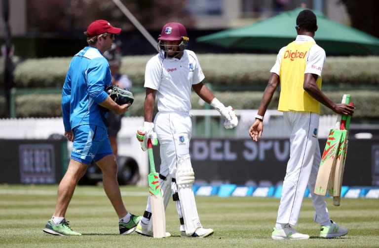 Sunil Ambris (C) of the West Indies retires hurt after a vicious blow to the forearm off a delivery from Neil Wagner during day four of the second Test against New Zealand