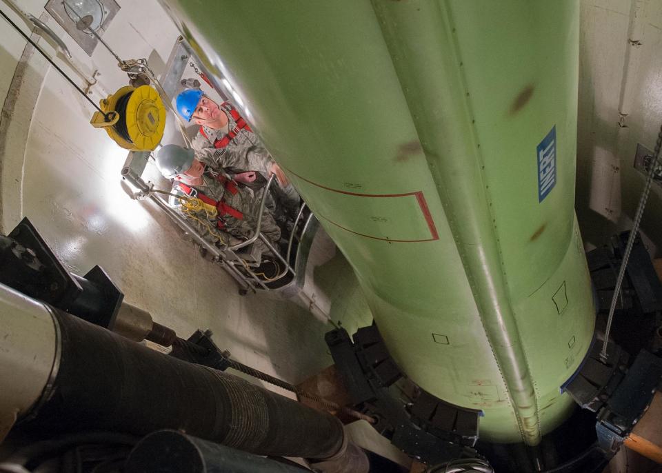 This image provided by the U.S. Air Force shows Air Force Chief of Staff Gen. Mark Welsh, right, and Tech. Sgt. Justin Richie, a 341st Maintenance Operations Squadron team trainer, riding in a work cage on Nov. 20, 2012, inside the T-9 maintenance trainer at Malmstrom Air Force Base, Mont. The Air Force says 34 nuclear missile launch officers at Malmstrom Air Force Base in Montana have been implicated in a cheating scandal and have been stripped of their certification. It is believed to be the largest such breach of integrity in the nuclear force.(AP Photo/U.S. Air Force, Beau Wade)